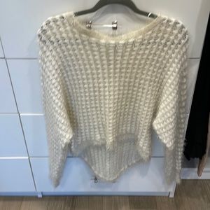 White soft sweater. Perfect condition. Longer in the back.